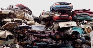 Old rusty cars piled on top of each other