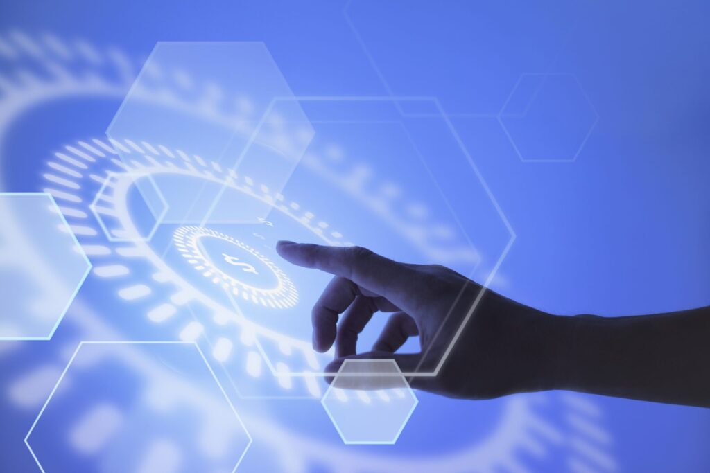 Hand pointing at blockchain currency graphic representing financial technology and cyber insurance