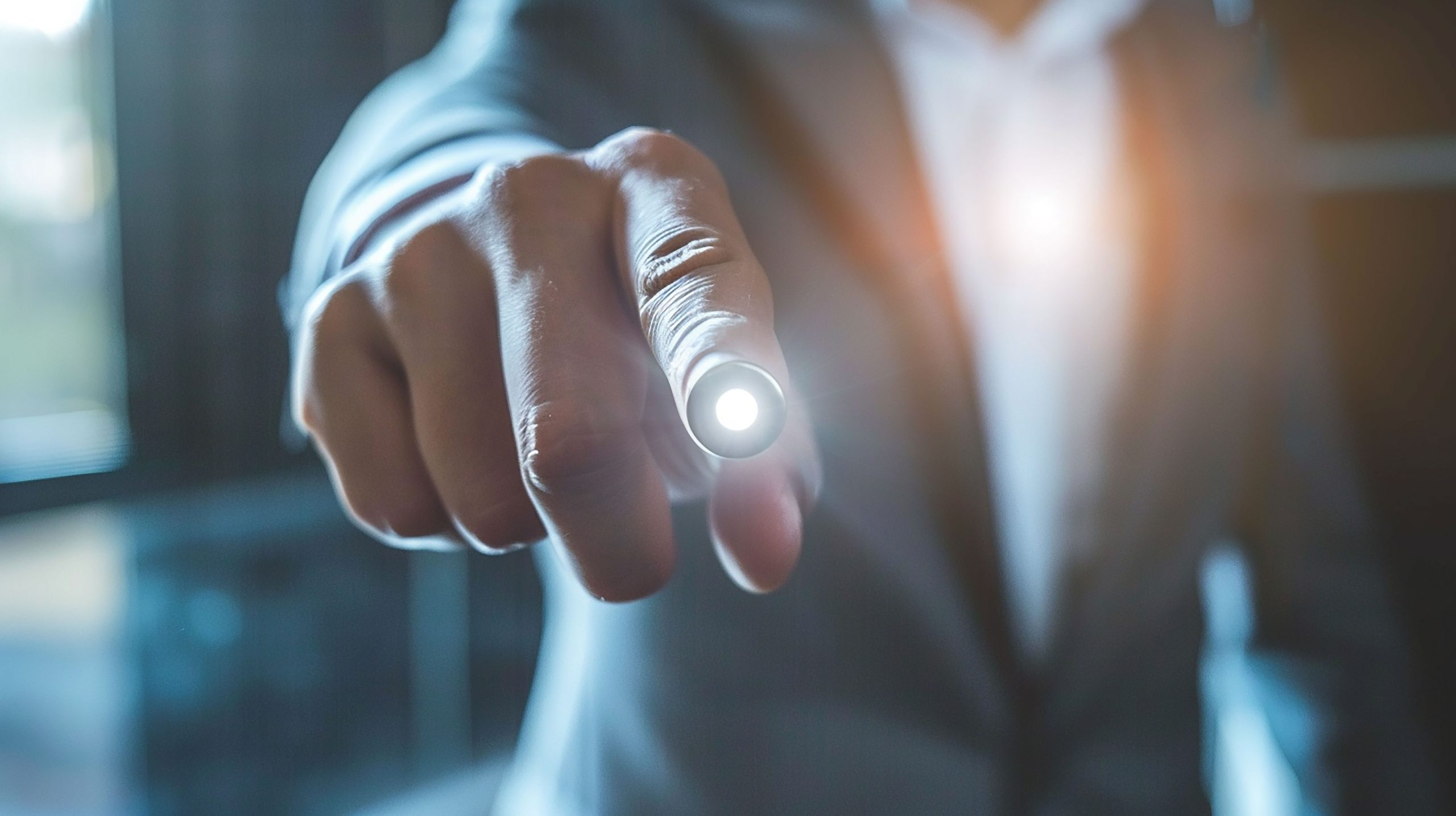 business professional guy standing with his finger touching light on the screen